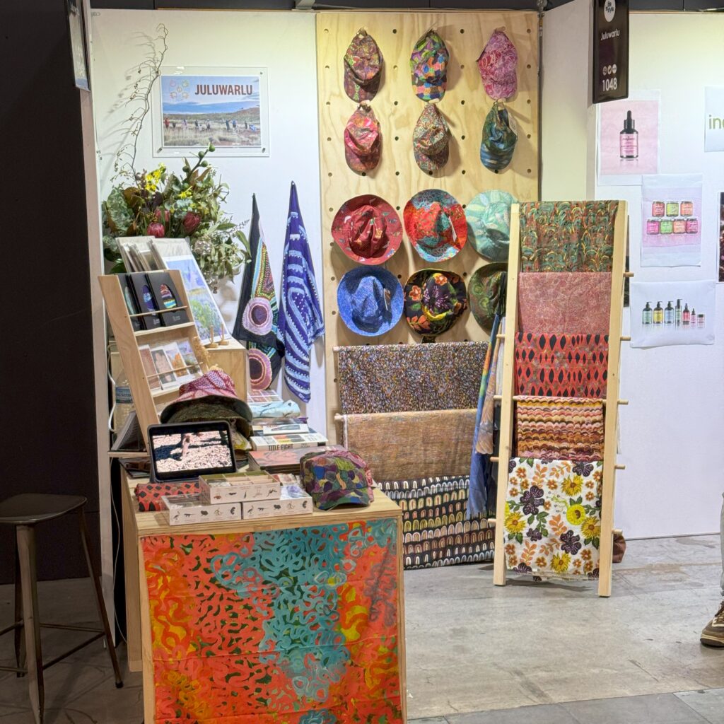 2x2m stand set up at life instyle tradeshow using a wall mounted pegboard, msc counter and ladder frame