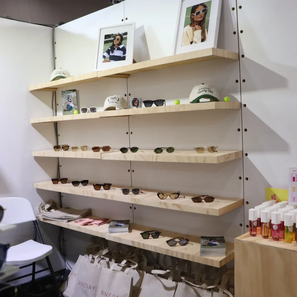 create an expo stand - pacific optics at reed gift fair 2025 using shop shelving panels in white