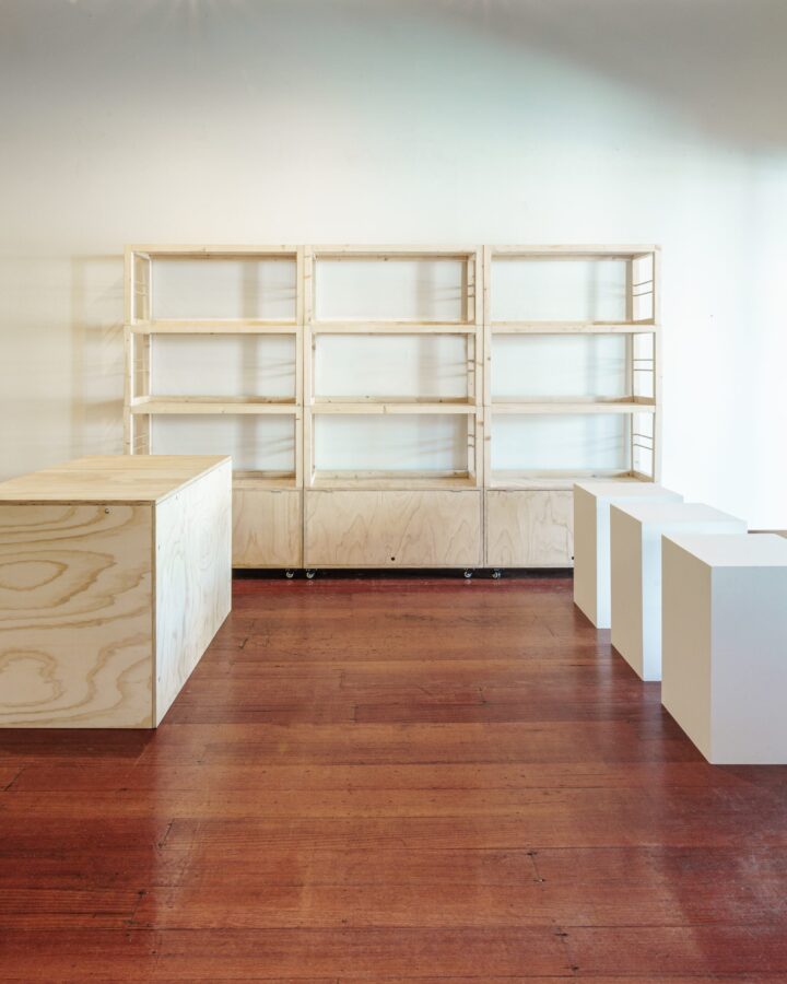 three stacked shelving units, one msc counter and three white plinths