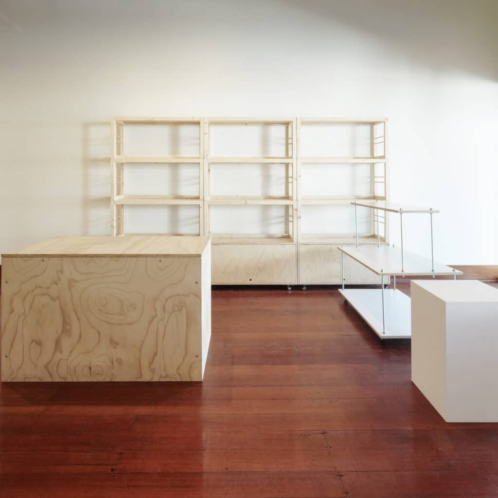 floorplan including stacked shelving units, msc counter, white centred floating stand and white plinth