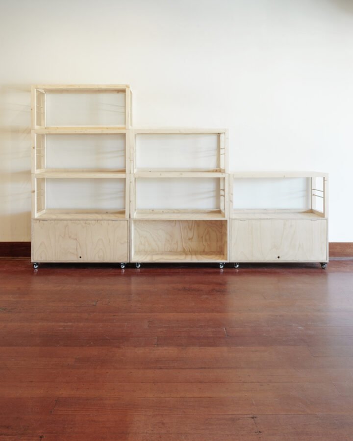 three stacked shelving units at different heights