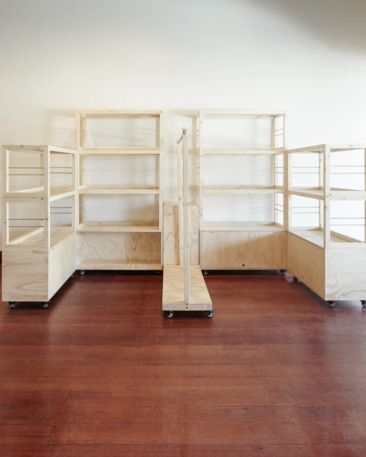 two stacked shelving units 3 shelves high, two stacked shelving units 2 shelves high and one rolling rack