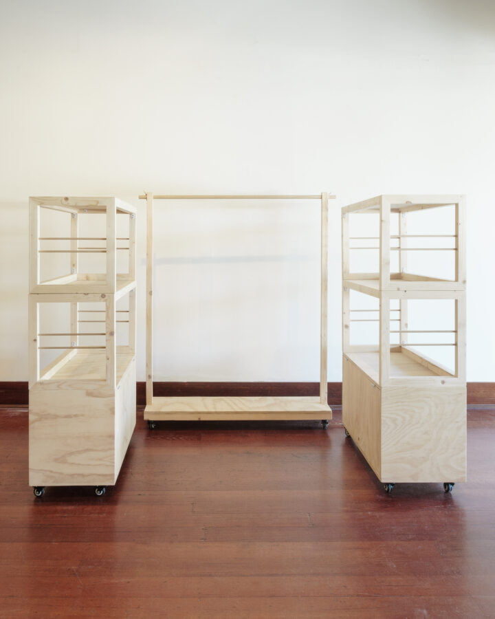 two stacked shelving units at two shelves high and a rolling rack
