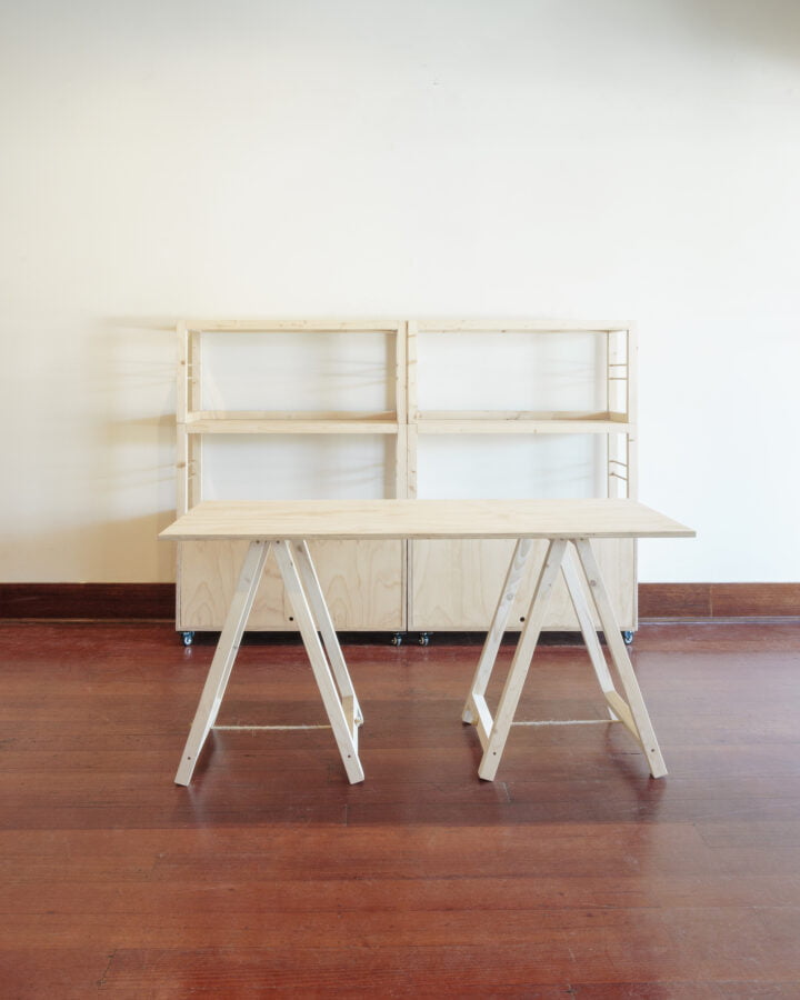 two stacked shelving units and two shelves high and a trestle table
