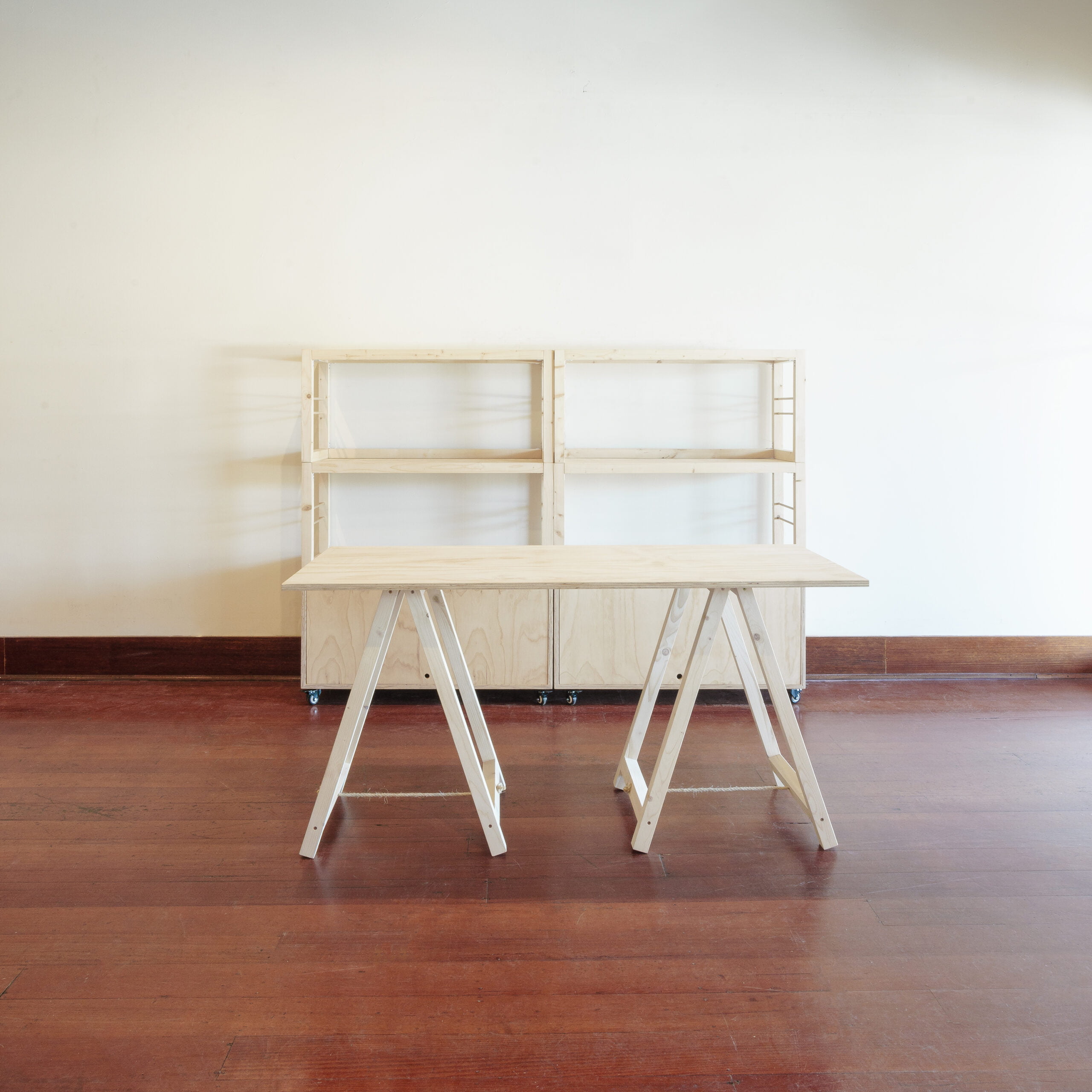 two stacked shelving units and two shelves high and a trestle table
