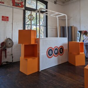 stacked painted orange plinth boxes for bws pop up event
