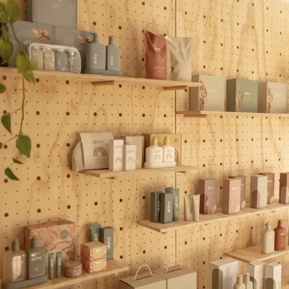 essential display furniture - Pegboard display with products on shelves