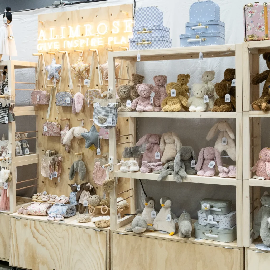create an expo stand - alimrose reed gift fair 2025 using stacked shelving unit and pegboard with cabinet