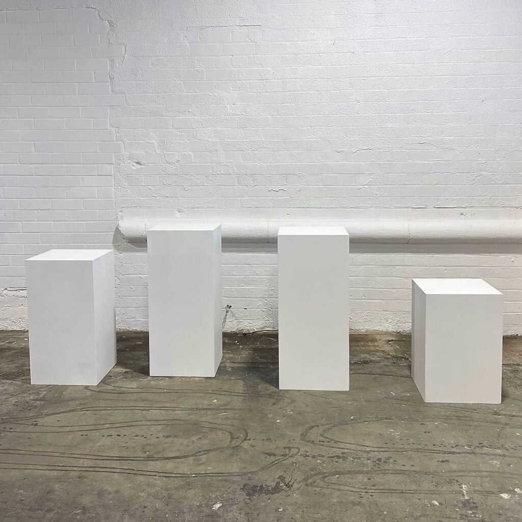 white plinths in a row